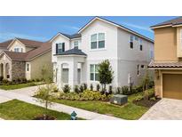 Charming two-story home with landscaped yard and well-maintained lawn in a desirable neighborhood at 9071 Sunshine Ridge Loop, Kissimmee, FL 34747