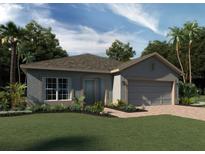 Charming single-Gathering home featuring a two-car garage, arched entryway, and well-manicured lawn with tropical landscaping at 14729 Erice Ave, Clermont, FL 34714