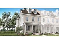 Charming two-story home with a welcoming front porch and manicured lawn at 2374 Celebration Blvd, Celebration, FL 34747