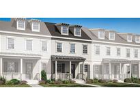 Charming new construction townhome featuring a welcoming front porch and classic architectural details at 2380 Celebration Blvd, Celebration, FL 34747