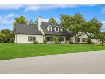 Charming two-story home with a manicured lawn and inviting front porch at 1660 Justin Matthew Way, St Cloud, FL 34771