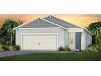 Charming single-Gathering home featuring a two-car garage, craftsman details and lush landscaping against a colorful sunset backdrop at 2338 Lily Bloom Rd, St Cloud, FL 34771