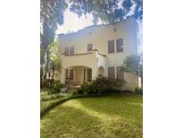Stunning two-story home with a charming front porch and well-manicured lawn at 501 Richmond St, Orlando, FL 32806