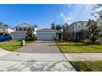 Charming single-Gathering home with a brick driveway and well-maintained front yard at 5029 Grand Teton Ct, Deland, FL 32724