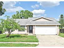 Charming single-story home with a well-maintained lawn and inviting curb appeal at 5588 Garden Grove Cir, Winter Park, FL 32792