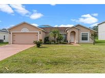 Charming single-story home with a well-maintained lawn and inviting curb appeal at 135 Inconnu Ct, Kissimmee, FL 34759