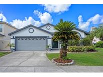 Charming single-Gathering home with a well-maintained lawn and a two-car garage at 14566 Quail Trail Cir, Orlando, FL 32837