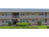 Attractive two-story building with a pleasant entrance and well-maintained landscaping at 1100 E Caroline St # 204, Tavares, FL 32778