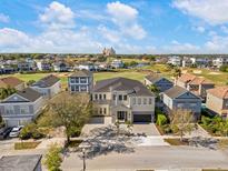 Stunning two-story home with a manicured lawn and picturesque views of the surrounding neighborhood at 1526 Euston Dr, Reunion, FL 34747