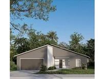 Modern home with a gray exterior, well-manicured landscaping, and an attached garage at 15300 Sw 62Nd Ct, Ocala, FL 34473