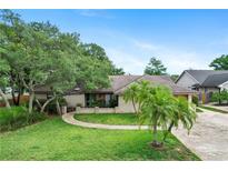 Charming single story home with a beautifully landscaped front yard and inviting walkway at 283 Haverclub Ct, Longwood, FL 32779