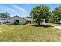 Charming single-story home with a well-maintained lawn and mature trees, offering a welcoming curb appeal at 2350 Derbyshire Rd, Maitland, FL 32751