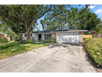 Charming home with a well-maintained lawn, stone accents, and a spacious two-car garage at 3029 Pinetree, Winter Haven, FL 33884