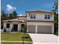 Charming two-story home with a tile roof, green lawn, two-car garage, and blue door at 523 Sanctuary Golf Pl, Apopka, FL 32712