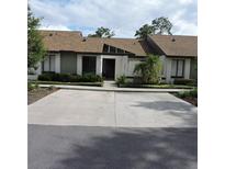 Charming single-story home featuring a well-maintained lawn and a two-car driveway at 2480 Tahoe Cir # 2480, Winter Park, FL 32792