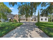 Stunning home with a long driveway and beautiful landscaping at 5801 Marleon Drive Marleon Drive, Windermere, FL 34786