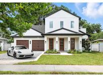 Stunning two-story home featuring a 3-car garage and a well-manicured lawn at 1780 Mizell Ave., Winter Park, FL 32789