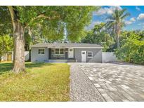 Inviting single-story home with a charming front porch and well-manicured landscaping at 706 19Th St, Orlando, FL 32805