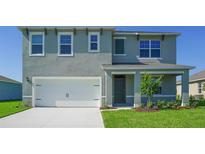 Charming two-story home with a two car garage and a well-maintained front yard at 766 Mocking Jay Ln, St Cloud, FL 34771