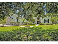 Charming home with a beautifully landscaped front yard and stone accents, providing great curb appeal at 14128 Bramble Bush Ct, Orlando, FL 32832