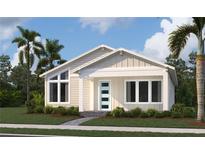 Inviting single-story home featuring a covered porch, modern front door, and well-manicured landscaping at 2971 Embark Trail, St Cloud, FL 34771