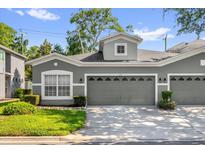 Charming home featuring a well-manicured lawn, neat landscaping and a large two car garage at 1122 Sandstone Run, Sanford, FL 32771
