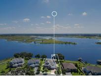 This property features a large yard, lake access, and is situated in a desirable neighborhood at 15787 Tangerine Dream Ct, Winter Garden, FL 34787