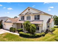 Charming two-story home with manicured landscaping and welcoming curb appeal in a well-maintained neighborhood at 2512 Chapala Dr, Kissimmee, FL 34746