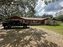 Charming ranch-style home featuring a well-maintained lawn and a welcoming facade at 3540 Garland St, Mulberry, FL 33860