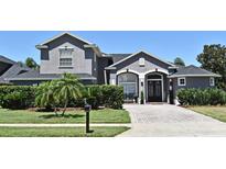 Charming home with a paved driveway, manicured lawn, and lovely landscaping at 436 Skyview Pl, Chuluota, FL 32766