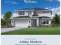 Two-story home featuring white stucco, a two-car garage, and beautifully landscaped yard at 8062 Timberwood Ln, Alafaya, FL 32825