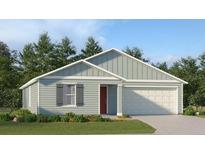 Charming single-story home with a two-car garage, neat landscaping, and a red front door at 4600 Sw 84Th Street Rd, Ocala, FL 34476