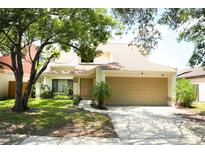 Charming single-Gathering home with a well-manicured lawn and a two-car garage at 7939 Winter Song Dr, Orlando, FL 32825