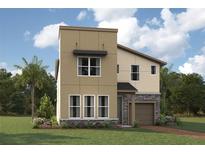Two-story home featuring a modern exterior, complemented by lush landscaping and a well-manicured lawn at 2320 Salty Winds Way, Kissimmee, FL 34747