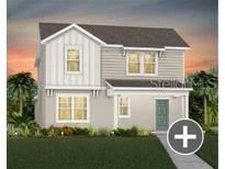 Charming two-story home with gray siding and a well-manicured lawn at 7432 Olivewood Ave, Orlando, FL 32829