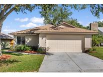 Charming single-story home features a two-car garage, well-maintained lawn, and beautiful landscaping at 1346 Palo Alto Ct, Winter Springs, FL 32708