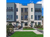Stylish townhome showcases modern architectural details and appealing landscaping at 2273 Valentine Aly, Orlando, FL 32804