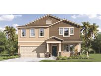 Charming two-story home featuring a two-car garage, manicured lawn, and a mix of stucco and shingle siding at 3337 Arch Ave, Ormond Beach, FL 32174