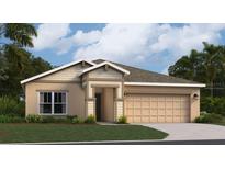 Charming single-story home with a well-maintained lawn and attached two-car garage at 431 Puma Loop, Groveland, FL 34736