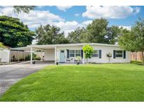 Charming single-story home with well-manicured lawn, covered parking and front seating area at 4106 Alverado St, Orlando, FL 32812