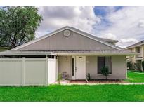 Charming single-story home featuring a lovely front door, complemented by a well-manicured lawn and a cozy, inviting entrance at 4438 Pinebark Ave # 4, Orlando, FL 32811