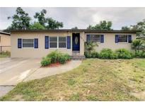 Charming single-story home with blue shutters and a well-maintained front yard at 5615 Arundel Dr, Orlando, FL 32808