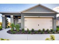 Charming single-Gathering home with a two-car garage and manicured landscaping at 3665 Fort Mellon Ln, Sanford, FL 32773