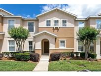 Charming townhome with well-manicured landscaping and a welcoming entryway at 12621 Tanja King Blvd, Orlando, FL 32828
