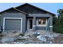 Exterior view of home during construction showing the garage and front entrance at 134 W Northside Dr, Lake Wales, FL 33853