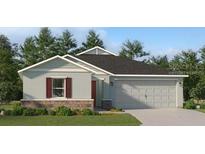 Charming single-story home featuring a two-car garage and well-maintained landscaping at 4737 Katrina Dr, Haines City, FL 33844
