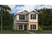 Charming two-story home with a combination of beige siding and stucco exterior and simple landscaping at 7256 Summer Ivy Aly, Orlando, FL 32829