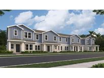 Charming new townhomes with a sidewalk and well-maintained landscaping for a welcoming curb appeal at 7358 Ivy Tendril Ave, Orlando, FL 32829