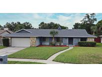 Charming single Gathering home with a well maintained lawn, stone accents, and a neutral paint scheme at 173 Tollgate Br, Longwood, FL 32750