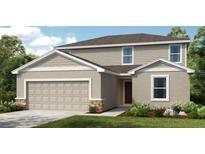 Charming two-story home with a two-car garage, manicured lawn and neutral paint scheme at 325 Cornerstone Dr, Groveland, FL 34736